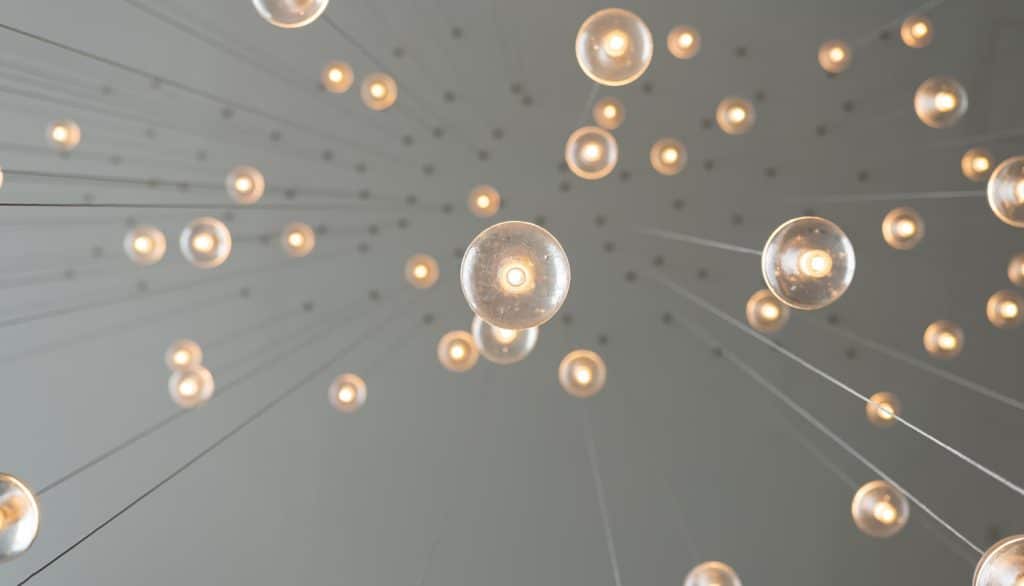 a group of lights from a ceiling
